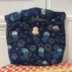 Pochette Agathe en tweed bleu marine, turquoise et argenté tissé et fabriquée en France
