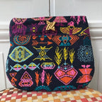 Pochette Irène en tweed bleu marine, orange, rose, turquoise et jaune tissé et fabriquée en France