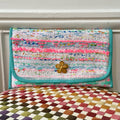 Pochette Alexandre en tweed bleu, rose fluo, blanc et vert d'eau tissé et fabriquée en France