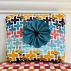 Pochette Régis en tweed jaune moutarde, marron, bleu, vert d'eau et corail tissé et fabriquée en France