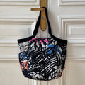 Sac François en tweed noir, blanc, rose, orange et bleu klein tissé et fabriqué en France